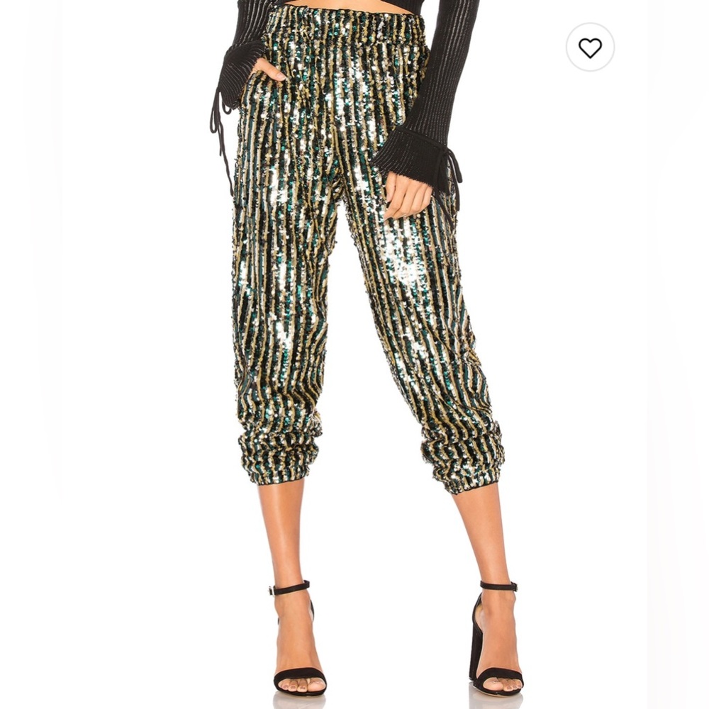 Rendered in luxurious sequins that shimmer all night long, eye-catching pant